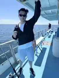 Holding a freshly caught fish on a fishing boat off Tampa, Florida